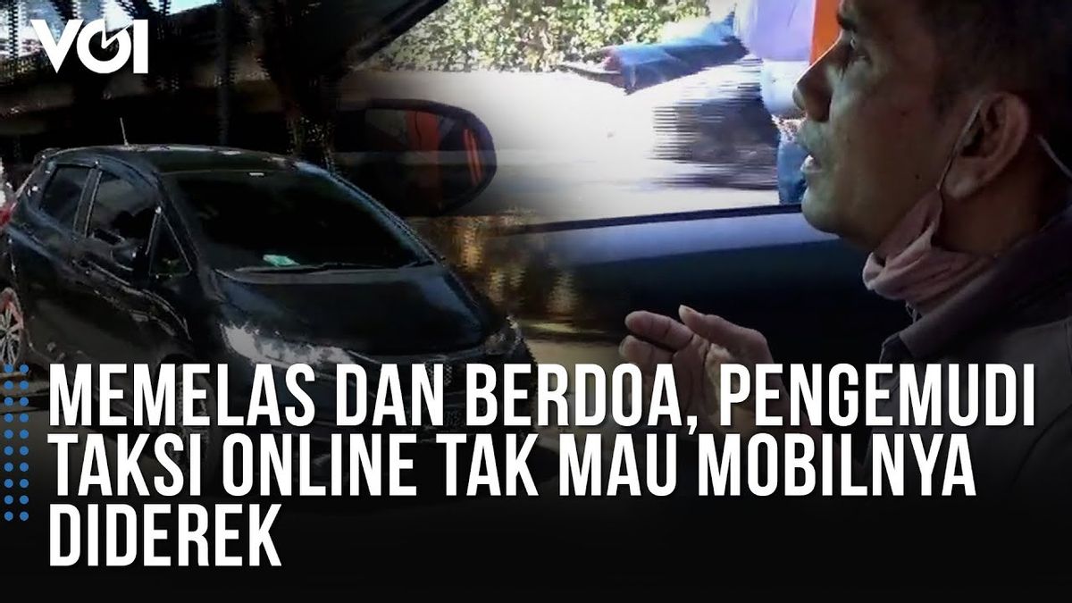 ビデオ:オンラインタクシー運転手は、車が牽引されようとしているときに頼んで祈ります