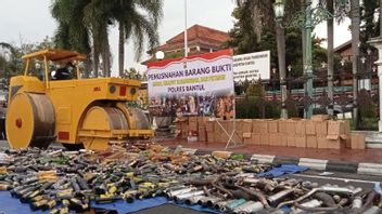 2,500 Bottles Of Liquor Destroyed Using Heavy Equipment By The Bantul Police