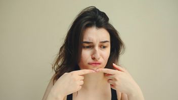 顔のこれらの3つの兆候は、あなたのストレスの量を明らかにすることができます