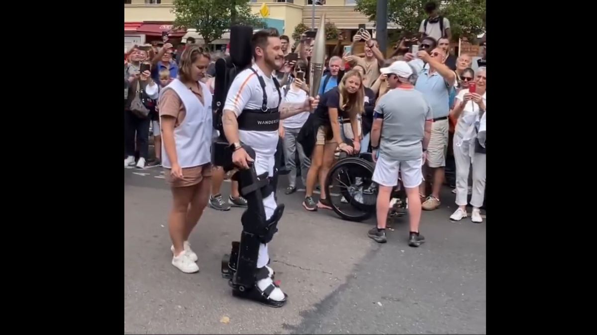 Touching Moment: French Paralympic Athlete Kevin Piette Brings Olympic Torch With Robotic Exoskeleton