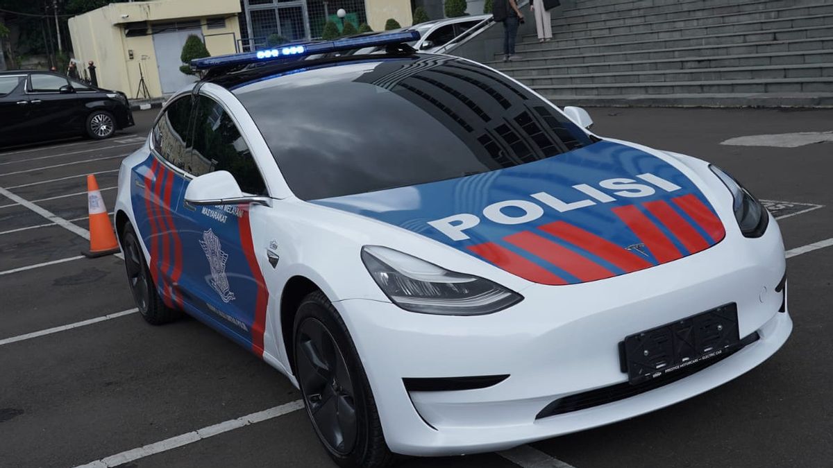 Waiting For Traffic Corps Action On The Streets With A Luxury Tesla Car