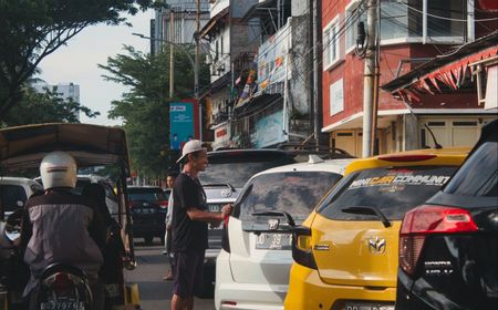 Mengurai Akar Masalah Menjamurnya Tukang Parkir Liar